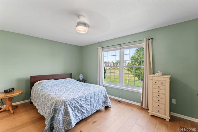 11118 Strathmore Ct, Grand Blanc, MI 48439 - bedroom featuring wood finished floors, baseboards, and ceiling fan