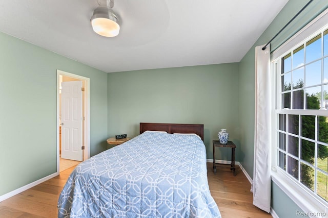 11118 Strathmore Ct, Grand Blanc, MI 48439 - bedroom featuring wood finished floors and baseboards