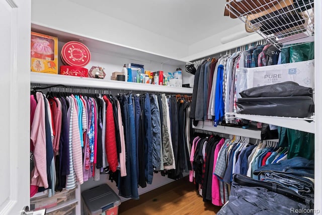 11118 Strathmore Ct, Grand Blanc, MI 48439 - walk in closet with wood finished floors