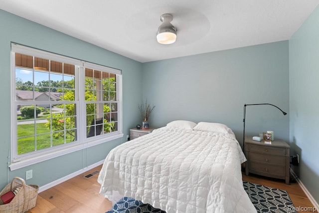 11118 Strathmore Ct, Grand Blanc, MI 48439 - bedroom with wood finished floors and baseboards