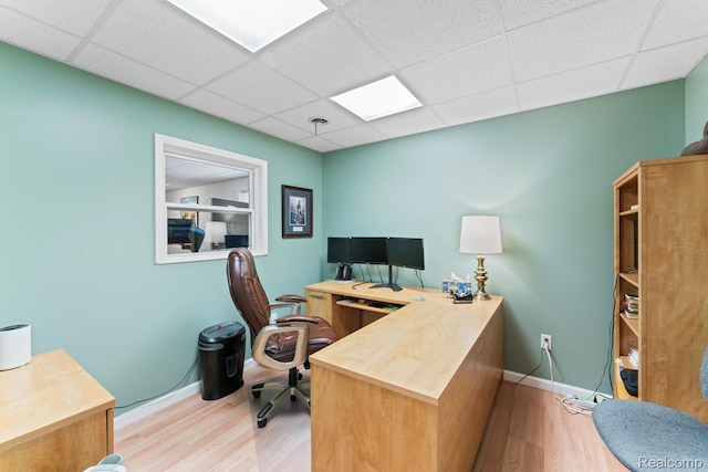 11118 Strathmore Ct, Grand Blanc, MI 48439 - office area featuring a drop ceiling, wood finished floors, and baseboards