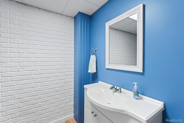 11118 Strathmore Ct, Grand Blanc, MI 48439 - bathroom featuring vanity, a paneled ceiling, and wood finished floors