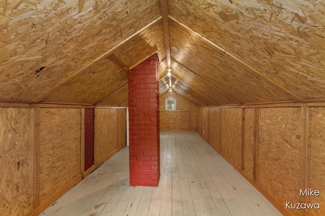 16742 148th Ave, Spring Lake, MI 49456 - bonus room featuring light wood-style floors, vaulted ceiling, and wood walls