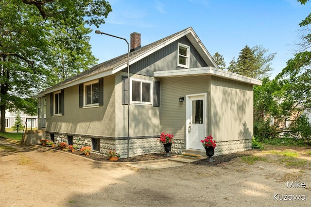 16742 148th Ave, Spring Lake, MI 49456 - view of front of house with a chimney