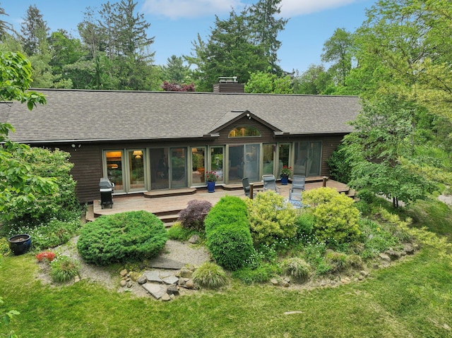 3377 Timberwood Ln, Ann Arbor, MI 48103 - rear view of house with roof with shingles, a deck, and a chimney
