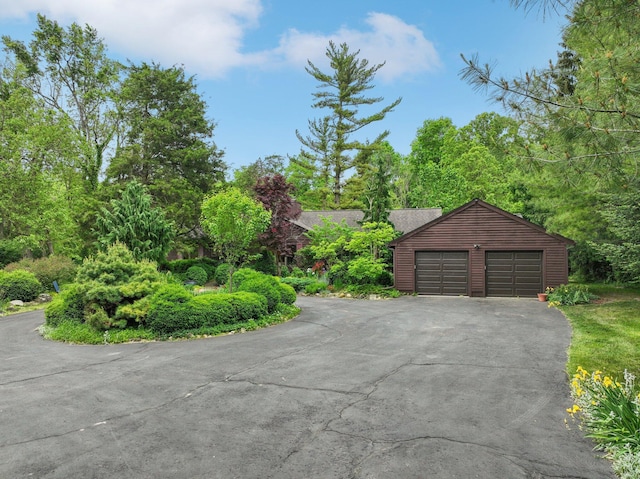 3377 Timberwood Ln, Ann Arbor, MI 48103 - garage featuring asphalt driveway