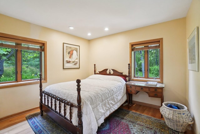 3377 Timberwood Ln, Ann Arbor, MI 48103 - bedroom with wood finished floors, baseboards, and recessed lighting