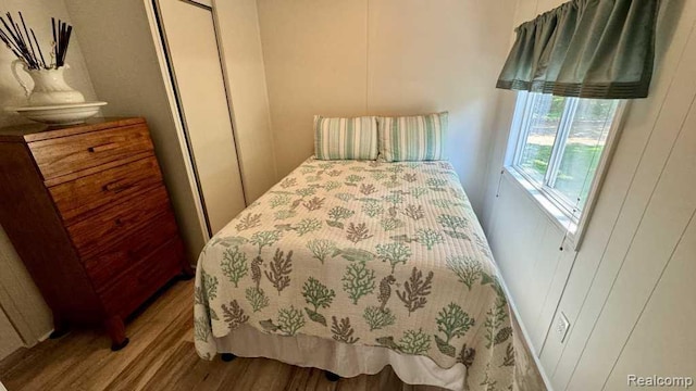 3840 Beech St, Burtchville, MI 48059 - bedroom featuring wood finished floors