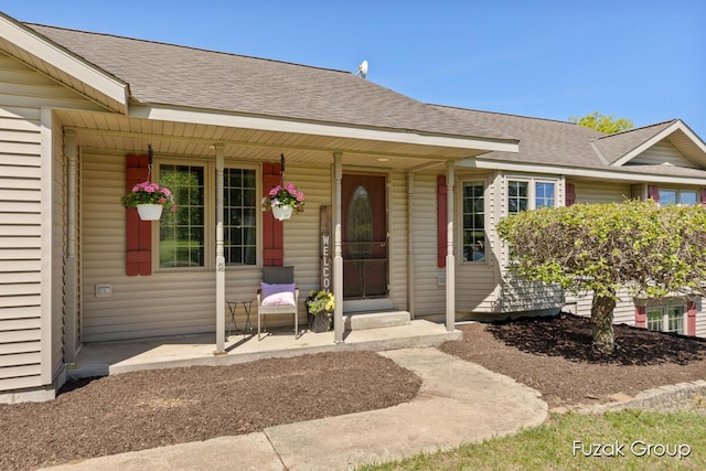 3882 40th St, Hamilton, MI 49419 - property entrance featuring a porch and a shingled roof