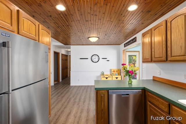 3882 40th St, Hamilton, MI 49419 - kitchen featuring appliances with stainless steel finishes, a peninsula, wooden ceiling, wood finished floors, and recessed lighting