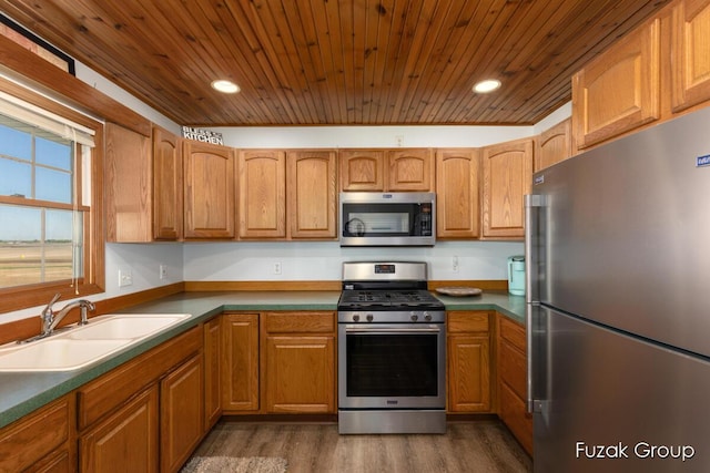 3882 40th St, Hamilton, MI 49419 - kitchen with appliances with stainless steel finishes, a sink, dark wood finished floors, wood ceiling, and recessed lighting