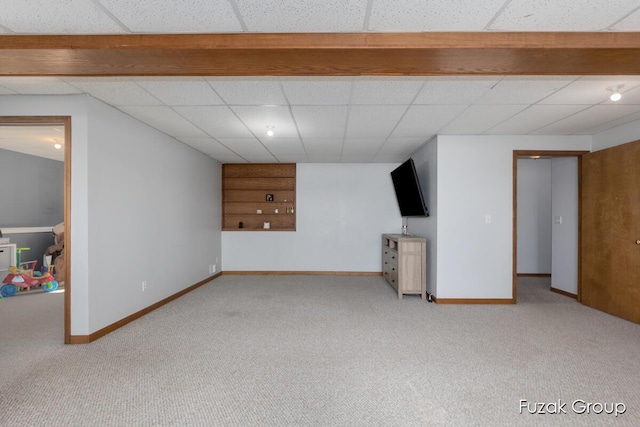 3882 40th St, Hamilton, MI 49419 - finished below grade area with carpet, baseboards, and a paneled ceiling