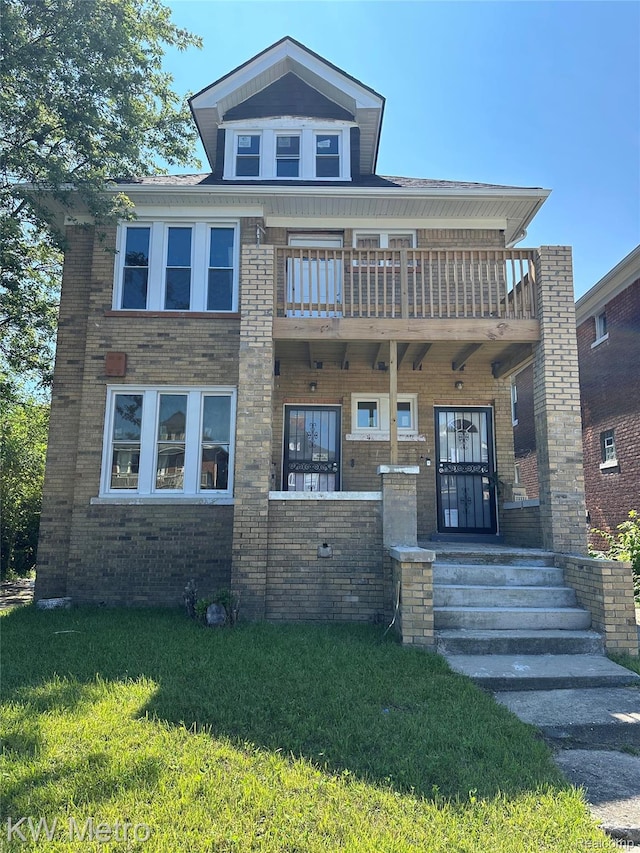3015 Gray St, Detroit, MI 48215 - view of front of home with a balcony, brick siding, and a front yard