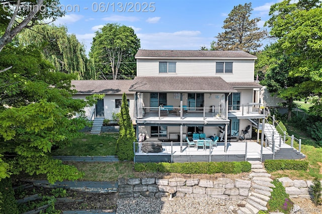 16039 Knobhill Dr, Argentine, MI 48451 - rear view of house with stairs, a patio area, a shingled roof, an outdoor hangout area, and a balcony