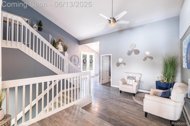 16039 Knobhill Dr, Argentine, MI 48451 - living area with baseboard heating, high vaulted ceiling, wood finished floors, baseboards, and stairs
