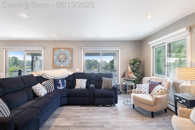 16039 Knobhill Dr, Argentine, MI 48451 - living room featuring healthy amount of natural light, baseboard heating, recessed lighting, and light wood-style flooring