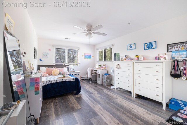 16039 Knobhill Dr, Argentine, MI 48451 - bedroom featuring wood finished floors, a baseboard heating unit, and ceiling fan