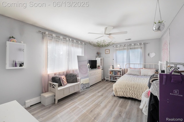 16039 Knobhill Dr, Argentine, MI 48451 - bedroom with baseboard heating, light wood-style floors, and a ceiling fan