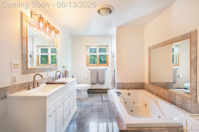 16039 Knobhill Dr, Argentine, MI 48451 - full bathroom featuring toilet, a baseboard heating unit, healthy amount of natural light, and double vanity