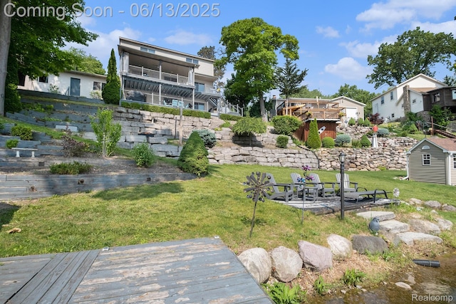 16039 Knobhill Dr, Argentine, MI 48451 - view of green lawn featuring a wooden deck and stairway