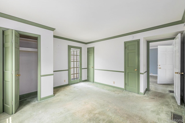 1111 W Park St, Lapeer, MI 48446 - unfurnished bedroom featuring ornamental molding, light colored carpet, and baseboards