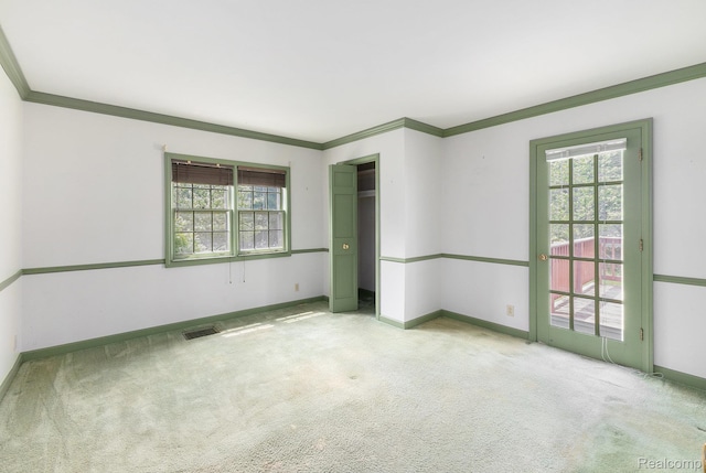 1111 W Park St, Lapeer, MI 48446 - carpeted spare room featuring plenty of natural light, baseboards, and crown molding