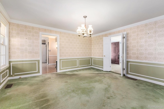 1111 W Park St, Lapeer, MI 48446 - empty room featuring a chandelier, wainscoting, carpet flooring, ornamental molding, and wallpapered walls