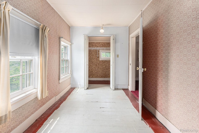 1111 W Park St, Lapeer, MI 48446 - hallway featuring wallpapered walls
