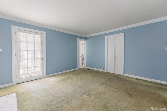 1111 W Park St, Lapeer, MI 48446 - spare room with ornamental molding, baseboards, and carpet flooring