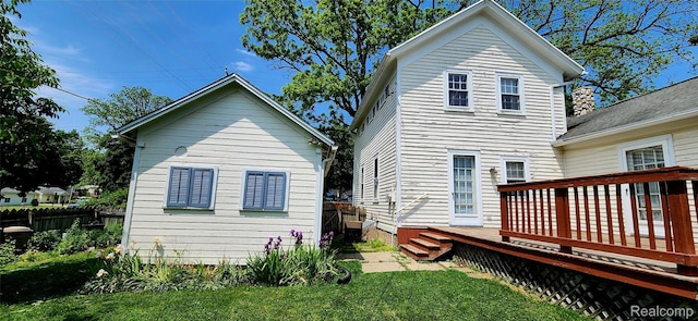1111 W Park St, Lapeer, MI 48446 - rear view of property featuring a wooden deck