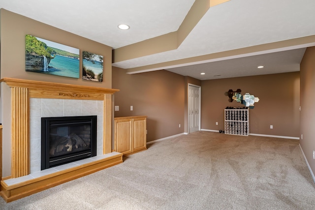 1754 Hightree Dr SW, Byron Center, MI 49315 - unfurnished living room featuring baseboards, carpet floors, a tiled fireplace, and recessed lighting