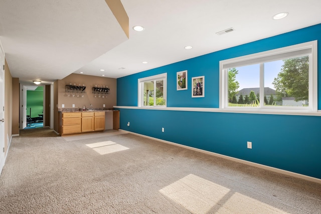 1754 Hightree Dr SW, Byron Center, MI 49315 - unfurnished living room with wet bar, recessed lighting, light carpet, and baseboards