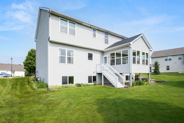 1754 Hightree Dr SW, Byron Center, MI 49315 - back of house with a sunroom, a lawn, and stairs