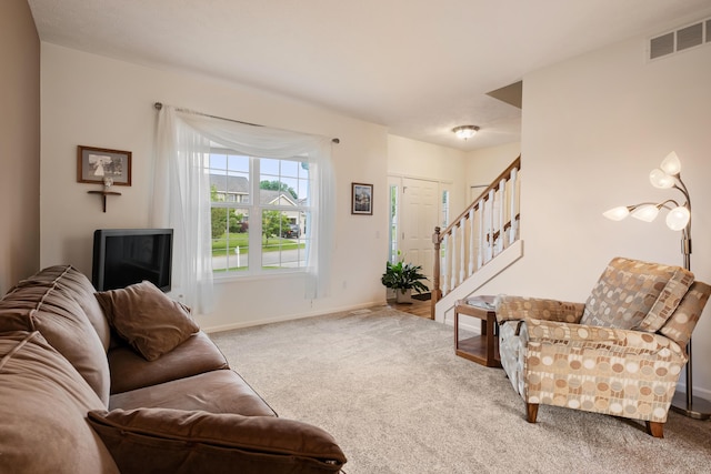 1754 Hightree Dr SW, Byron Center, MI 49315 - living room with carpet, stairs, and baseboards