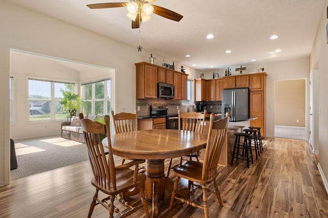 1754 Hightree Dr SW, Byron Center, MI 49315 - dining area featuring a ceiling fan, recessed lighting, light wood-style floors, and baseboards