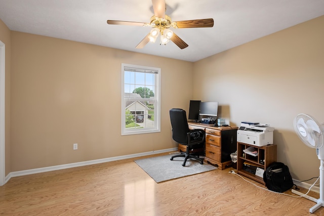 1754 Hightree Dr SW, Byron Center, MI 49315 - home office with light wood-style floors, baseboards, and a ceiling fan