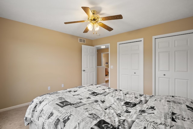 1754 Hightree Dr SW, Byron Center, MI 49315 - bedroom featuring carpet floors, multiple closets, baseboards, and ceiling fan