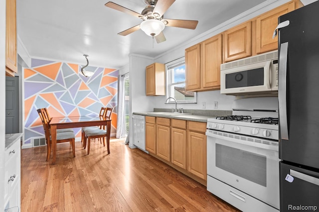33989 Richard St, Canton, MI 48184 - kitchen with white appliances, crown molding, a ceiling fan, light countertops, and light wood-style floors
