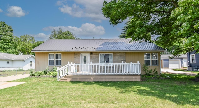 402 Division St, Union City, MI 49094 - single story home with a front yard, metal roof, and central AC unit