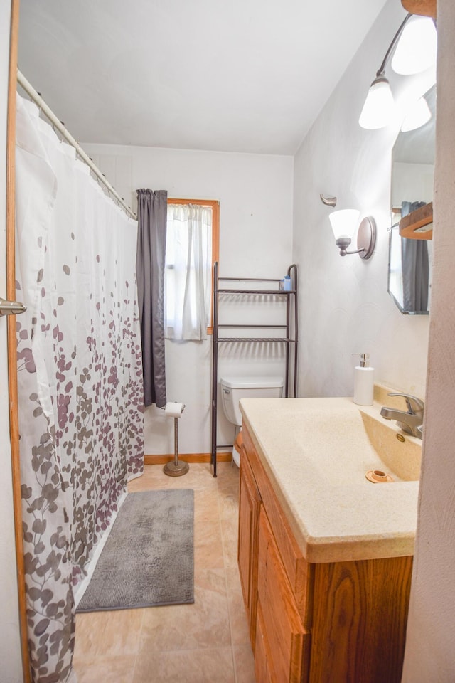 402 Division St, Union City, MI 49094 - bathroom with vanity, toilet, tile patterned floors, and a shower with curtain