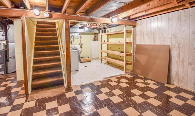 402 Division St, Union City, MI 49094 - unfinished basement with tile patterned floors, washer / clothes dryer, stairs, and wood walls