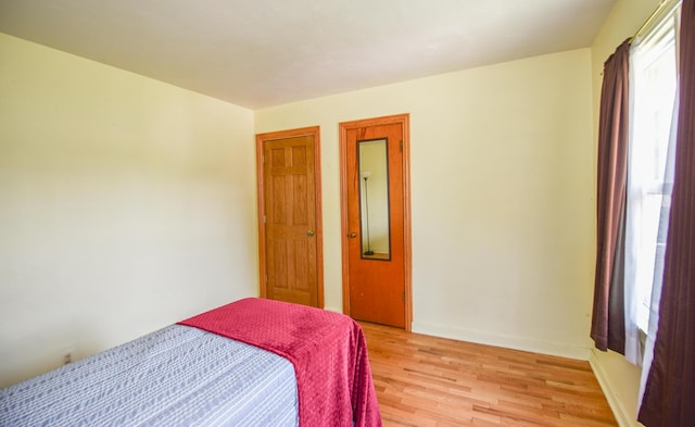 402 Division St, Union City, MI 49094 - bedroom with light wood-style floors and baseboards