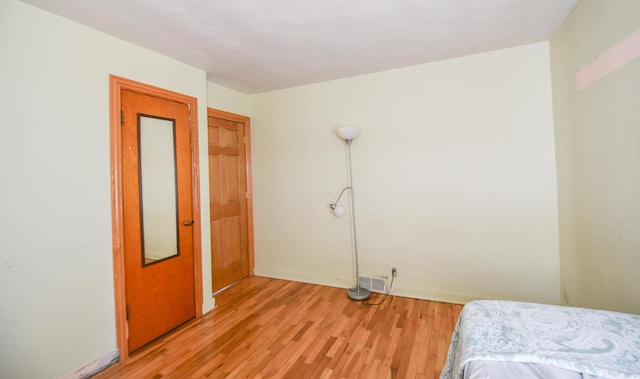 402 Division St, Union City, MI 49094 - bedroom with light wood-type flooring and baseboards