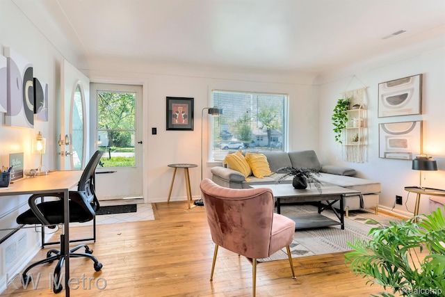 19391 Inkster Rd, Livonia, MI 48152 - living area with light wood-style floors and a desk