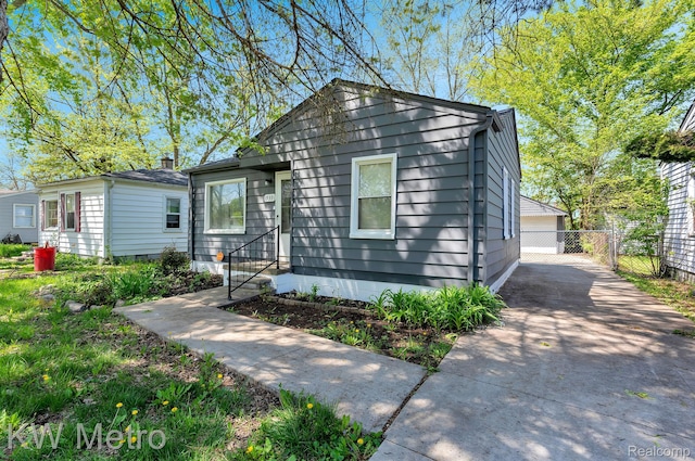 19391 Inkster Rd, Livonia, MI 48152 - bungalow featuring a detached garage and an outbuilding