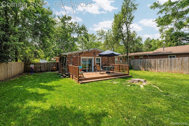 3341 Creek Dr, Ann Arbor, MI 48108 - rear view of property featuring brick siding, a wooden deck, and a fenced backyard