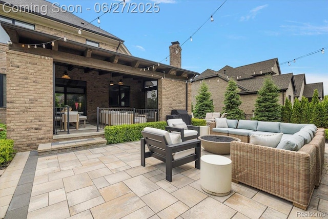 3610 Piccadilly Dr, Rochester Hills, MI 48309 - view of patio / terrace featuring an outdoor living space with a fire pit
