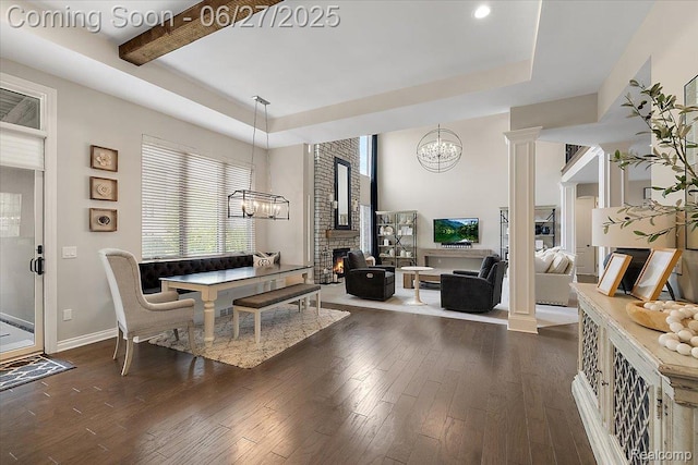 3610 Piccadilly Dr, Rochester Hills, MI 48309 - living area with a chandelier, dark wood-style flooring, a fireplace, a tray ceiling, and recessed lighting
