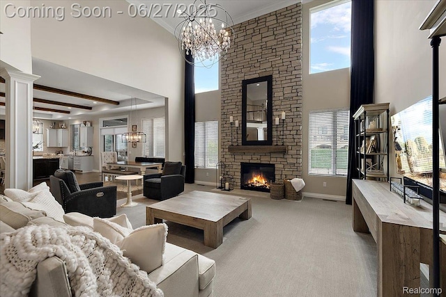 3610 Piccadilly Dr, Rochester Hills, MI 48309 - living area featuring a chandelier, carpet floors, a stone fireplace, a high ceiling, and crown molding