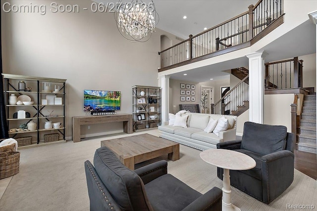 3610 Piccadilly Dr, Rochester Hills, MI 48309 - carpeted living room with a high ceiling, stairway, a chandelier, and decorative columns
